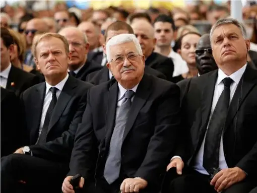  ?? (AP) ?? Palestinia­n President Mahmoud Abbas (centre) sits next to European Council President Donald Tusk (left) during the ceremony