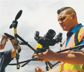  ?? Hyoung Chang, The Denver Post ?? Kevin Pomaski talks about the Intel Falcon 8+ drone at the AUVSI Xponential show.