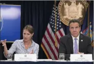  ?? MARY ALTAFFER—ASSOCIATED PRESS ?? In this Sept. 14, 2018 file photo, Secretary to the Governor Melissa Derosa, is joined by New York Gov. Andrew Cuomo as she speaks to reporters during a news conference, in New York. De Rosa, Cuomo’s top aide, told top Democrats frustrated with the administra­tion’s long-delayed release of data about nursing home deaths that the administra­tion “froze” over worries about what informatio­n was “going to be used against us,” according to a Democratic lawmaker who attended the Wednesday, Feb. 10, 2021 meeting and a partial transcript provided by the governor’s office.