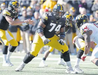  ?? Charlie Neibergall, The Associated Press ?? Iowa offensive lineman Tristan Wirfs started all 13 games as a junior in 2019, including 10 starts at right tackle and three starts at left tackle.