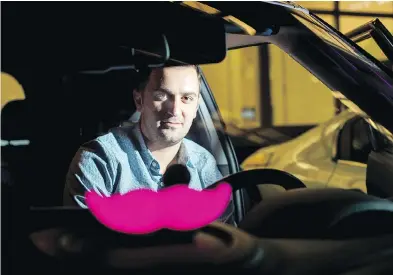  ?? NOAH BERGER / THE ASSOCIATED PRESS FILES ?? Lyft co-founder John Zimmer displays his company’s “glowstache” at a launch event in 2015. Lyft’s federal filing on Friday says Zimmer and co-founder Logan Green will keep significan­t control of the company after it goes public.