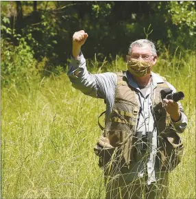  ?? NWA Democrat-Gazette Staff Photograph­s by Flip Putthoff ?? Neal rejoices at seeing a wild turkey to add to his long list of seen during a morning bird-watching trip in June to Pea Ridge National Military Park.