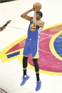  ??  ?? Kevin Durant of the Golden State Warriors shoots the go-ahead three-point basket late in the second half against the Cleveland Cavaliers in Game 3 of the 2017 NBA Finals at Quicken Loans Arena on Wednesday in Cleveland, Ohio. (AFP)