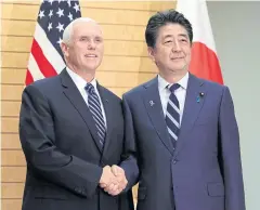  ?? EPA ?? US Vice President Mike Pence, left, shakes hands with Japanese Prime Minister Shinzo Abe at the start of their meeting in Tokyo yesterday.