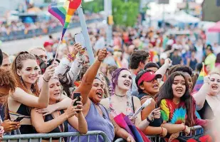  ?? [THE OKLAHOMAN ARCHIVES] ?? People at the OKC Pride Parade chant “We still love you” and other messages at a group of protesters last June.