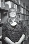  ?? Staff photo by Evan Lewis ?? Dr. Tonja Mackey originally came up with the idea of a book tree after seeing one on the internet. That first year Mackey assembled the tree at 4 a.m. because she said she wasn’t really sure how to do it and she didn’t want it falling on anyone.
