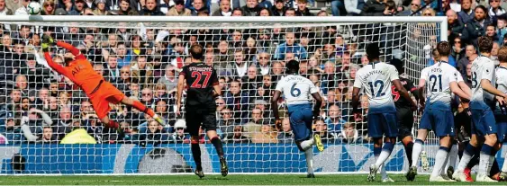  ??  ?? World class: Tottenham keeper Lloris makes a brilliant save from Juninho Bacuna’s free-kick AP