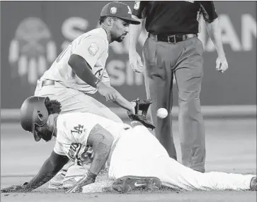  ?? Robert Gauthier Los Angeles Times ?? MATT KEMP of the Dodgers slides into second base with a double in the first inning as the throw to Oakland Athletics shortstop Marcus Semien from right fielder Stephen Piscotty arrives late. Kemp also hit a home run.