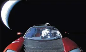  ?? PHOTO BY SPACEX VIA GETTY IMAGES ?? This photo provided by SpaceX shows a Tesla roadster launched in early February from the Falcon Heavy rocket with a dummy driver named “Starman.” It is heading toward Mars.