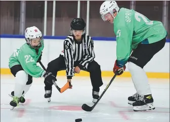  ?? ZHANG WEI / CHINA DAILY ?? Beijing 2022’s chief ice hockey advisor, Harald Springfeld (right), is married to Chinese hockey referee, Wang Hui (middle). The couple have one son, Wang Xiaolong (left).