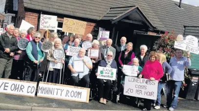  ??  ?? ●● Residents protesting against plans to charge for use of the Astle Court Community Room