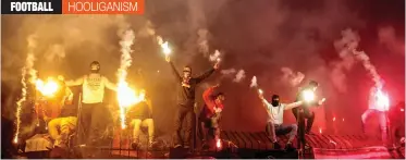  ?? — AP ?? Russian fans burn flares during a Russian Premier League Championsh­ip match between Arsenal Tula and Spartak Moscow in Tula, on December 1, 2017, in this file photo.