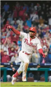  ?? MATT SLOCUM/AP ?? The Phillies’ Johan Rojas celebrates after hitting a gamewinnin­g single in the 10th inning against the Pirates on Sept. 26 in Philadelph­ia.