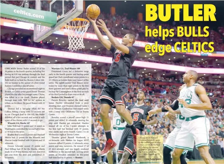  ??  ?? Chicago Bulls forward Cristiano Felicio (6) goes to the basket past Boston Celtics centre Al Horford (42) during the second quarter in game one of the first round of the 2017 NBA Playoffs at TD Garden.