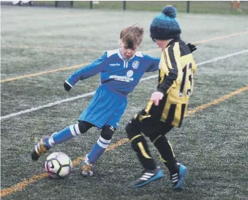  ??  ?? Seamer Under-Nines get on the ball during their hard-fought game against Scalby Otters