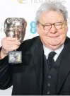  ?? REUTERS ?? Alan Parker celebrates after receiving the Fellowship award at the British Academy of Film and Arts awards ceremony at the Royal Opera House in London in 2013.