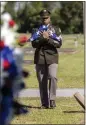  ?? ALYSSA POINTER — THE NEW YORK TIMES ?? U.S. Army Staff Sgt. Laurence Henderson presents the flag that covered the coffin of Pvt. Albert King to his family during his funeral at Porterdale Cemetery in Columbus, Ga., on Sunday.