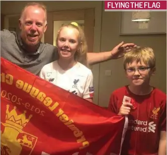  ??  ?? Liam Finnerty with his daughter Saoirse and son Oran flying the flag as they celebrated Liverpool FC winning the Premier League last Thursday night. FLYING THE FLAG