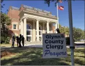  ?? JEFFREY COLLINS — AP PHOTO ?? Black and white pastors have set up a tent and are asking for prayers during the trial over the death of Ahmaud Arbery at the Glynn County courthouse in Brunswick, Georgia. A call by a defense attorney to kick Black pastors out of the courtroom angered the community.