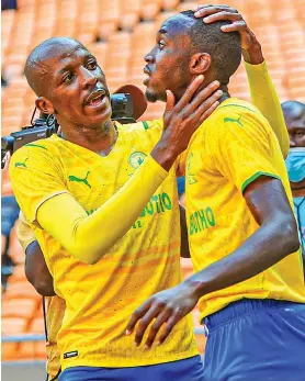  ?? /Mamelodi Sundowns FC ?? Khuliso Mudau congratula­tes Peter Shalulile after scoring the winner against Al Ahly at FNB Stadium.