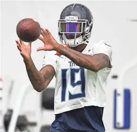  ??  ?? Titans wide receiver Tajae Sharpe pulls in a catch during practice Monday at Saint Thomas Sports Park. GEORGE WALKER IV / THE TENNESSEAN