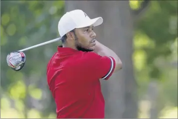  ?? Rob Carr / Getty Images ?? Harold Varner used four birdies on the back nine to help him rally from a four-shot deficit and tie for the lead after the third round of A Military Tribute at The Greenbrier on Saturday.