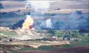  ?? Armenian Defense Ministr y ?? ARTILLERY f ire between Armenia and Azerbaijan intensif ied Tuesday. Above, a video image of the f ighting.