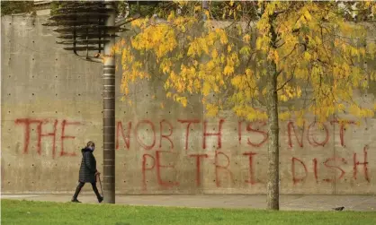  ?? Photograph: Oli Scarff/AFP/Getty Images ?? Graffiti in Greater Manchester reflects concerns from local leaders that the region is being told to adopt an experiment­al lockdown strategy.