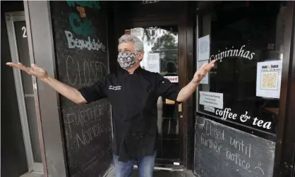  ?? Photograph: Charlie Neibergall/AP ?? Owner Claudio Gianello at his temporaril­y closed Café Beaudelair­e restaurant, on 23 June 2020 in Ames, Iowa, one of two cities in the state seeing the worst coronaviru­s surge in the country.