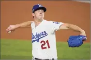  ?? Tony Gutierrez / Associated Press ?? Walker Buehler is scheduled to start for the Dodgers in Game 3 of the World Series Friday night.