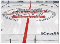  ?? ERIC MCCARTHY/JOURNAL PIONEER ?? It can’t get much more official than this: the Kraft Hockeyvill­e logo is now frozen into center ice at the O’Leary Community Sports Centre.