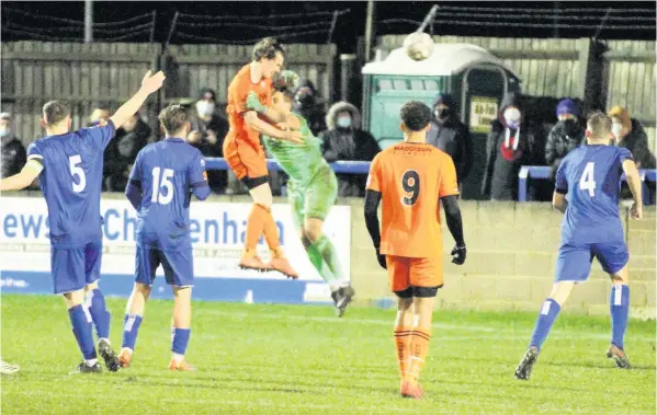  ??  ?? Freddie Grant beats Chippenham goalkeeper Will Puddy to the ball to head Bath level during the Boxing Day A4 derby