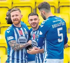  ??  ?? Greg Kiltie, centre, celebrates with Killie team-mates.