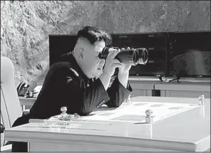  ?? AP ?? This image made from video of a news bulletin aired by North Korea’s KRT television on Tuesday shows North Korea leader Kim Jung Un as he watches the launch of a Hwasong-14 interconti­nental ballistic missile.