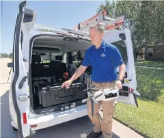  ?? REUTERS ?? Farmers Insurance claims adjuster Brent Hazen unloads a Kespry drone he will use to assess a home damaged by Hurricane Harvey, as part of the insurance company’s efforts to tackle claims related to the storm in Missouri City, Texas.
