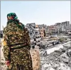  ?? BULENT KILIC/AFP ?? A member of the Syrian Democratic Forces, backed by US special forces, monitors the area on the western frontline in Raqa on Sunday.