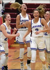  ??  ?? Members of the Waterford Our Lady of the Lakes girls basketball team celebrate during their 2020 CHSL Championsh­ip victory. The Lakers had their season ended while reaching the Division 4 regional championsh­ip. This season, the Lakers could be a Division four contender again but are in a holding pattern as the winter season has been halted due to COVID-19.