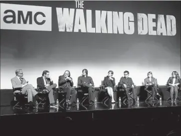 ?? Jesse Grant Getty Images for AMC ?? STUNTMAN John Bernecker died in a fall on the “Walking Dead” set. Above, cast and crew of the TV series.