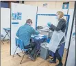  ?? Pictures: Habibur Rahman ?? TESTING The testing facility at Swanmore College, with, left, headteache­r Kyle Jonathan performing a self test