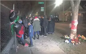  ?? RAQUEL RUTLEDGE / MILWAUKEE JOURNAL SENTINEL ?? Mourners attend a vigil Monday night for the victims of the car crash Friday that killed four members of a family. Killed were Larry G. Williams Jr., 29; Ayana M. Hill, 22; Yana Williams, 2; and Larry G. Williams IV, 5 months.