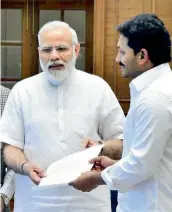  ??  ?? YSRC president Y.S. Jagan Mohan Reddy submits a memo to Prime Minister Narendra Modi.