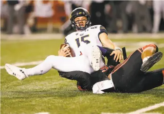  ?? Rick Bowmer / Associated Press ?? Utah defensive end Maxs Tupai sacks Cal’s Robby Rowell for an 8yard loss on the Bears’ final possession. Cal quarterbac­ks Spencer Brasch and Rowell were limited to 60 yards passing.