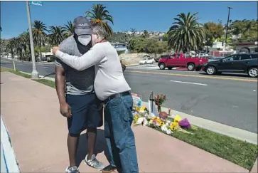  ?? Gina Ferazzi Los Angeles Times ?? PHIL PASCAL of Las Vegas, left, and Danny Blain of San Clemente visit the site of Kurt Andras Reinhold’s death near the Hotel Miramar. Pascal was Reinhold’s classmate at Clark Atlanta University in Georgia.