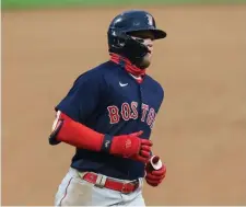  ??  ?? RED HOT: Red Sox slugger Alex Verdugo rounds the bases after hitting a solo shot in the seventh inning of game two.