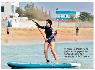  ??  ?? Regina Cassandra on the stand-up paddle board during her recent race in Chennai