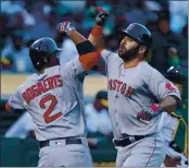  ?? ANDA CHU — BAY AREA NEWS GROUP, FILE ?? Mitch Moreland, right, celebrates his two-run home run with former Red Sox teammate Xander Bogaerts (2) at the Coliseum in Oakland in May 2017.