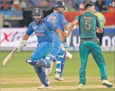  ?? AFP ?? ▪ Rohit Sharma (left) made 52 and put on 86 for the first wicket with Tuesday’s centurion Shikhar Dhawan.