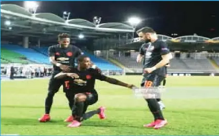  ?? Photo: Reuters ?? Manchester United’s Odion Ighalo (centre) celebratin­g his goal against Austria’s LASK during their UEFA Europa League Last 16 Round...last night. United won the first leg 5-0.