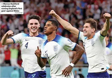  ?? Francois Nel ?? > Marcus Rashford celebrates after scoring England’s first goal against Wales