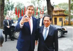  ??  ?? HANOI: US Secretary of State John Kerry (left) arrives with Vietnam’s acting Foreign Minister Bui Thanh Son, at the Ministry of Foreign Affairs, before their meeting on Friday in Hanoi. —AP